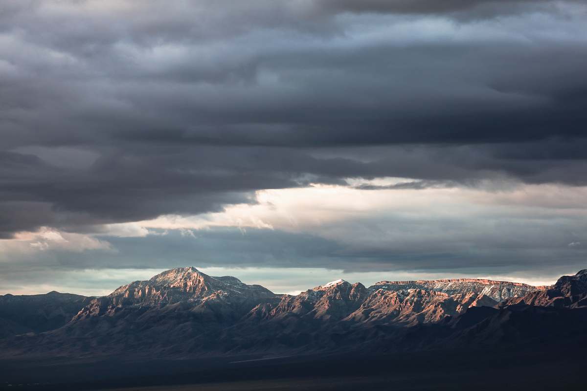 mountain range mountain under nimbus cloud cloud